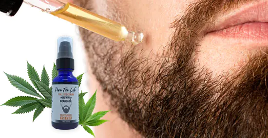 брадясал мъж слага CBD олио за брада върху косматото си лице